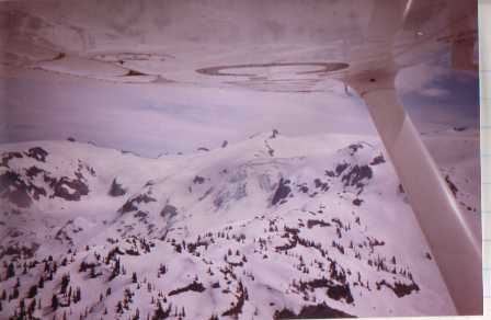 Glacier reflecting in aircraft wing near Garibaldi